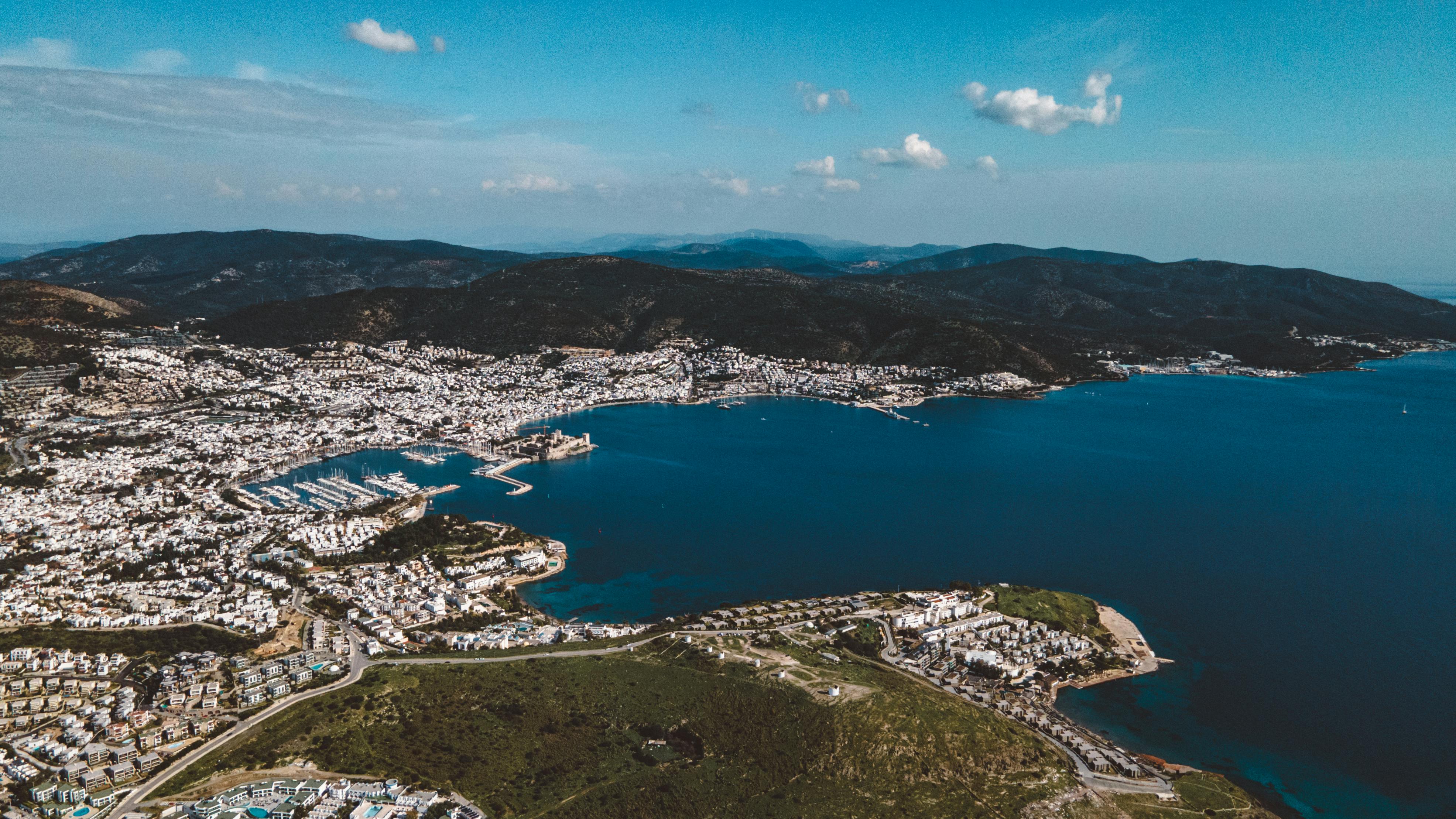 A beautiful, panoramic view of a non-Asia Pacific destination like the Swiss Alps or Mediterranean coast, representing high-end travel.